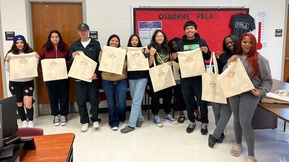 students holding bags